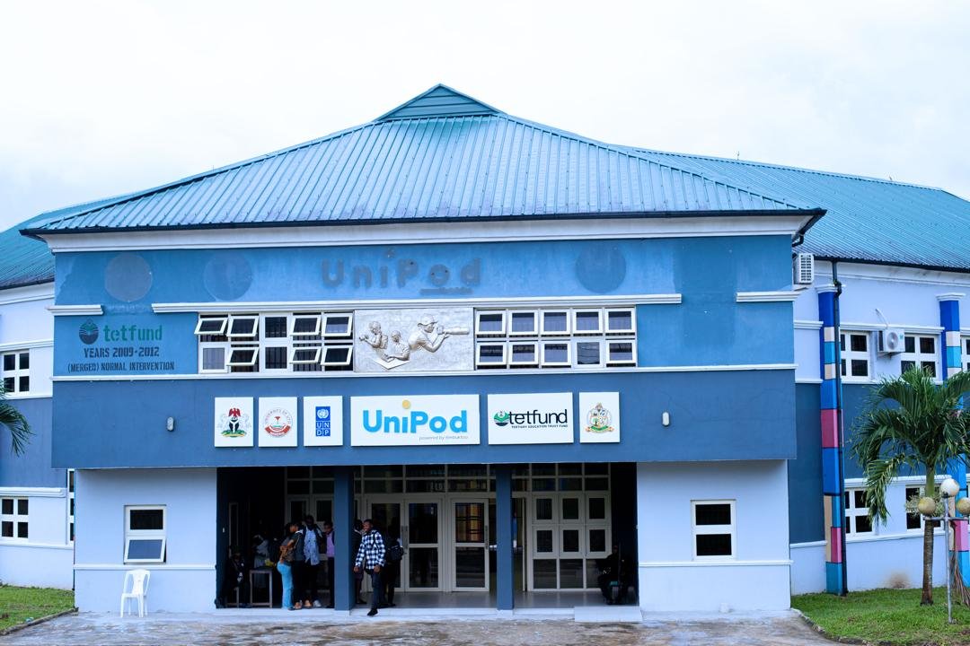 Side view of the blue and white UniPod building